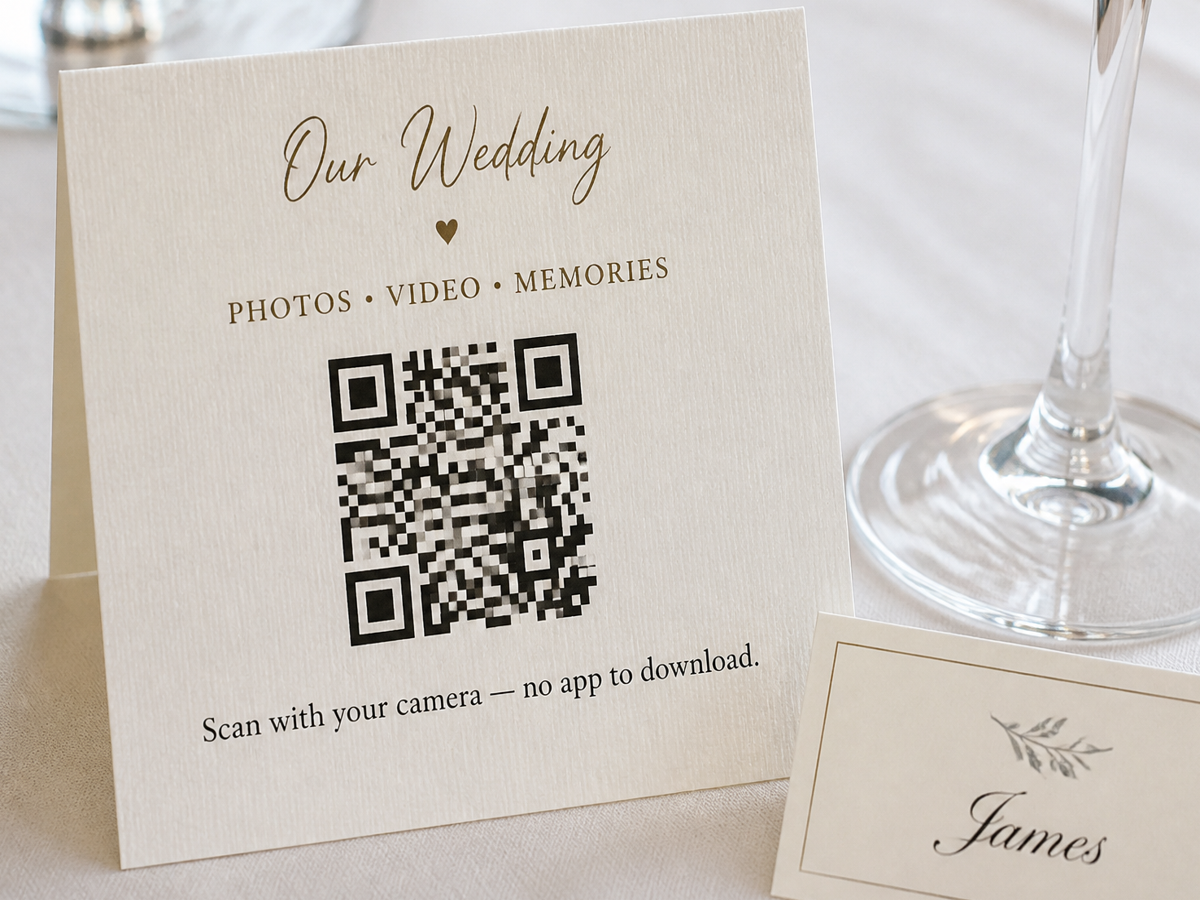 Reception table card inviting guests to scan and share photos after the ceremony