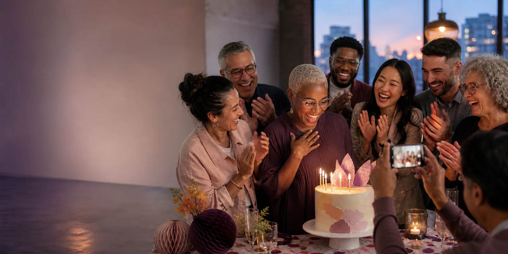 A group cheering together at a milestone celebration
